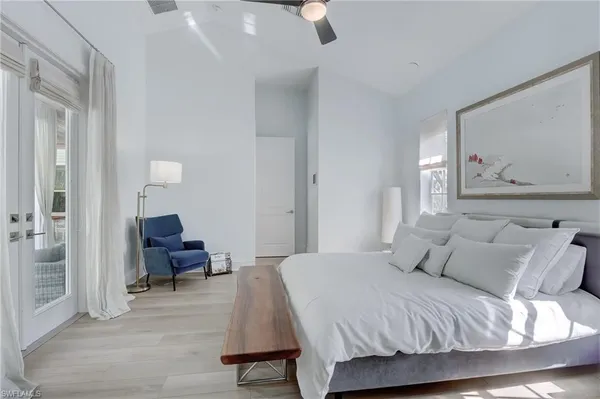 a bedroom with a bed and lamp