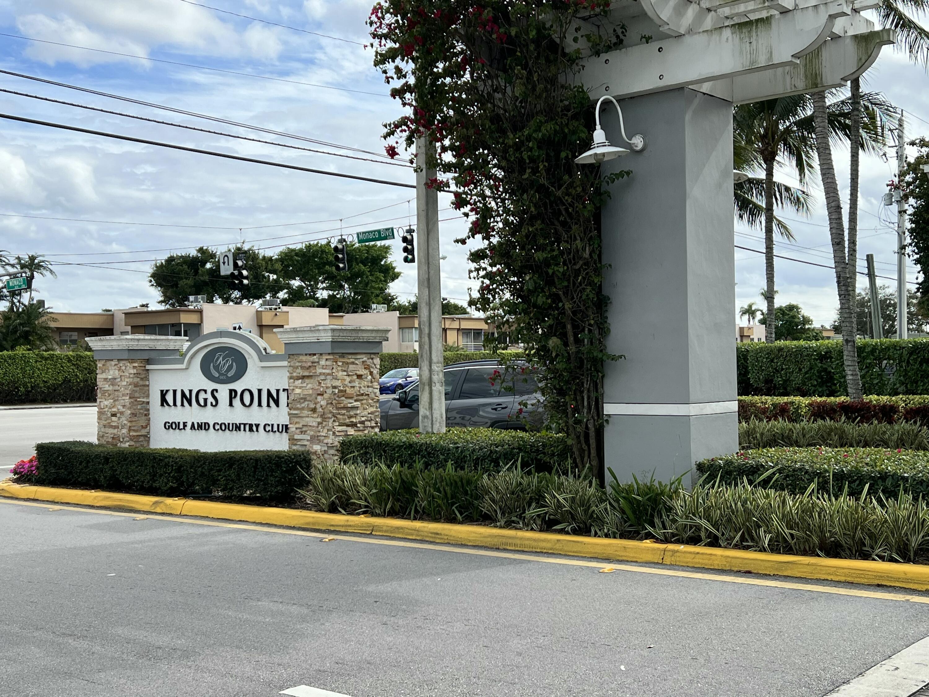 179 Monaco Way Delray Beach, FL 33446 - Photo 3 of 8 a sign that is on the side of a building