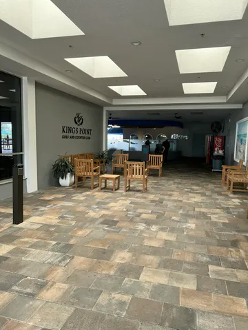 a room with lots of table and chairs