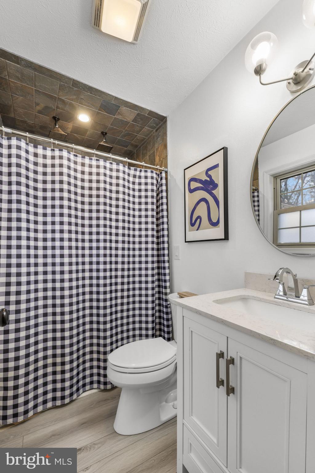 323 Palmer Road Basye, VA 22810 - Photo 16 of 30 a bathroom with a toilet sink and shower