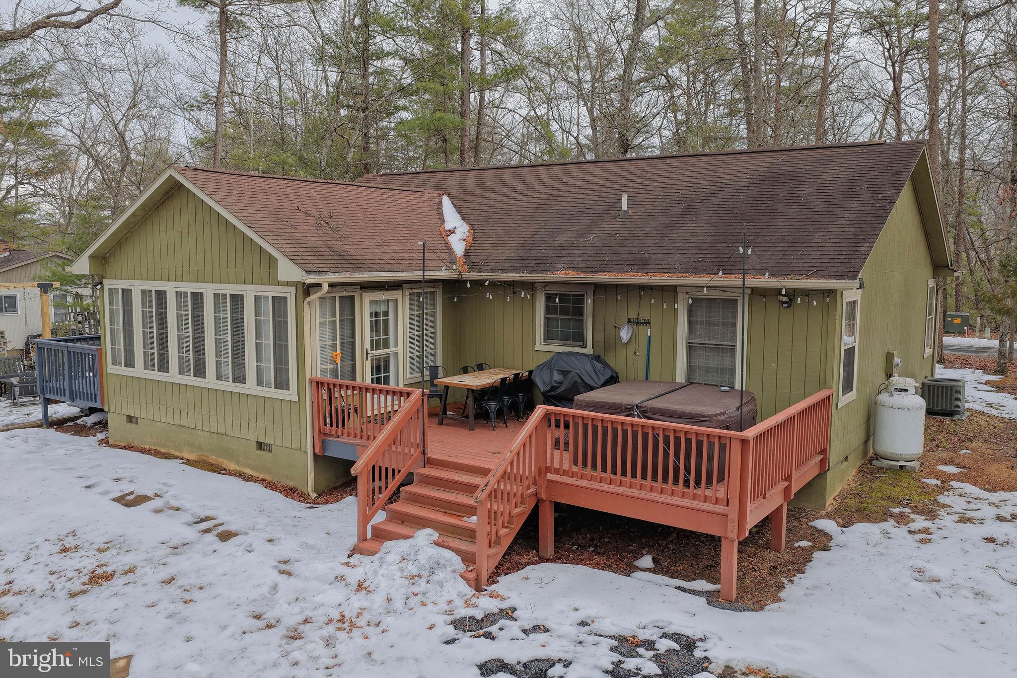 323 Palmer Road Basye, VA 22810 - Photo 23 of 30 a view of a house with a bed and wooden floor