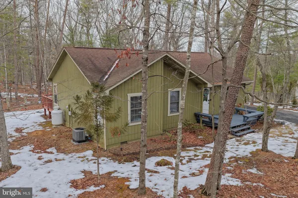a view of a house with a tree