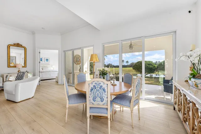a large kitchen with stainless steel appliances kitchen island granite countertop a stove and a sink