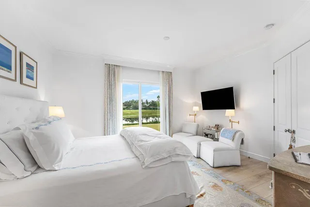 a spacious bathroom with a double vanity sink mirror and bathtub