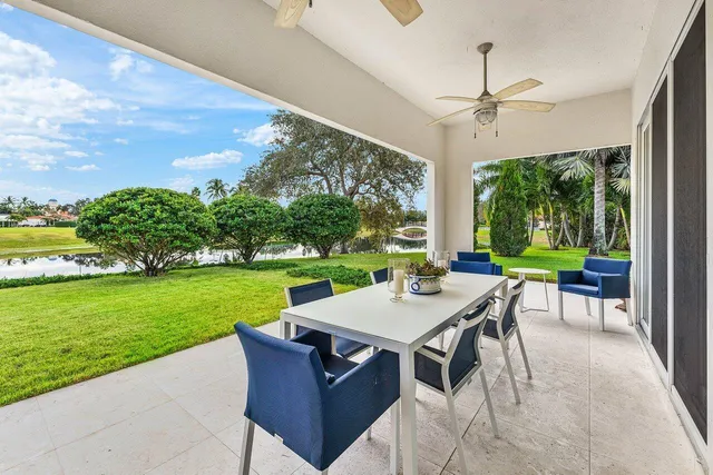 a room with pool table and outdoor seating