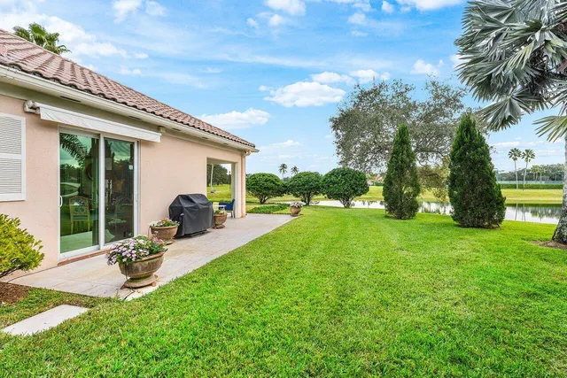 a front view of house with yard and outdoor seating