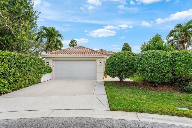 a view of a lake with houses in the back