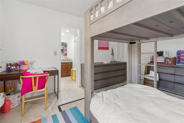 a bed room with a bed and a desk