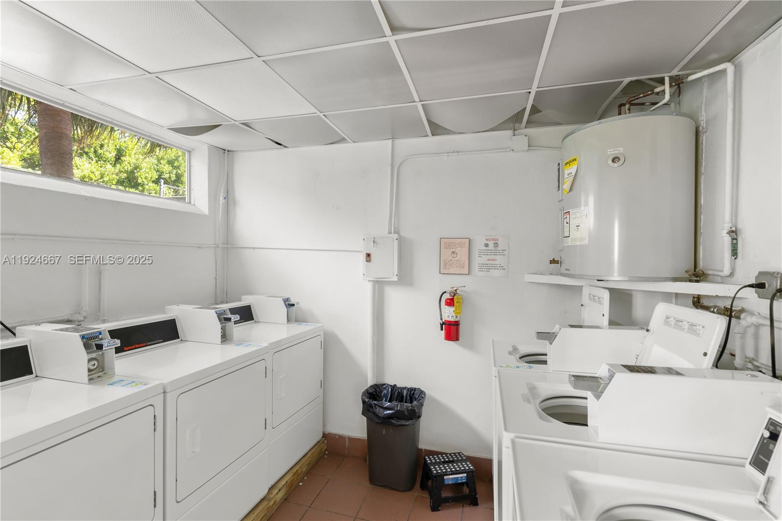 555 Crandon Boulevard, Unit 21 Key Biscayne, FL 33149 - Photo 19 of 32 a utility room with sink dryer and washer