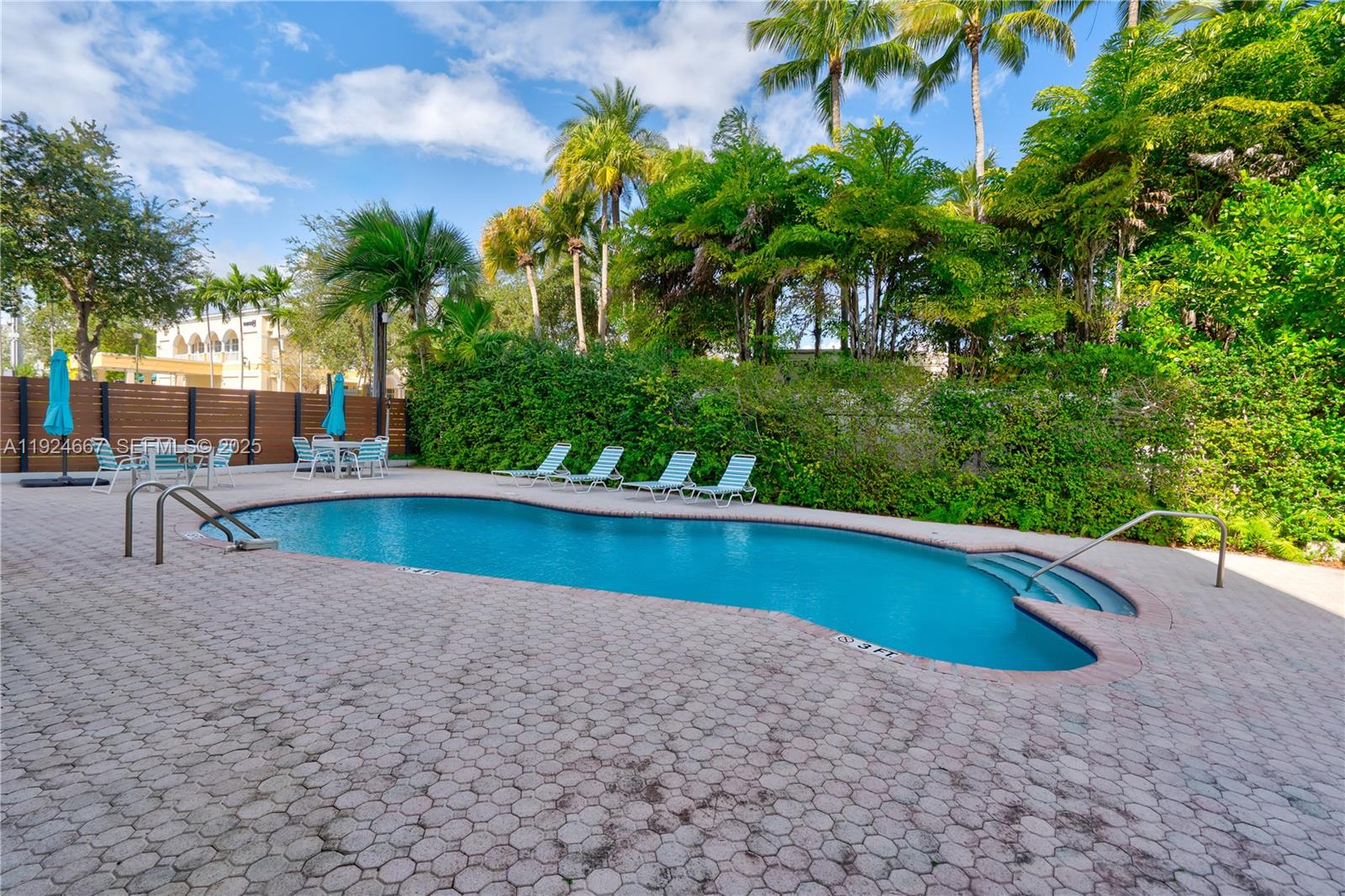 555 Crandon Boulevard, Unit 21 Key Biscayne, FL 33149 - Photo 23 of 32 a view of swimming pool with chairs