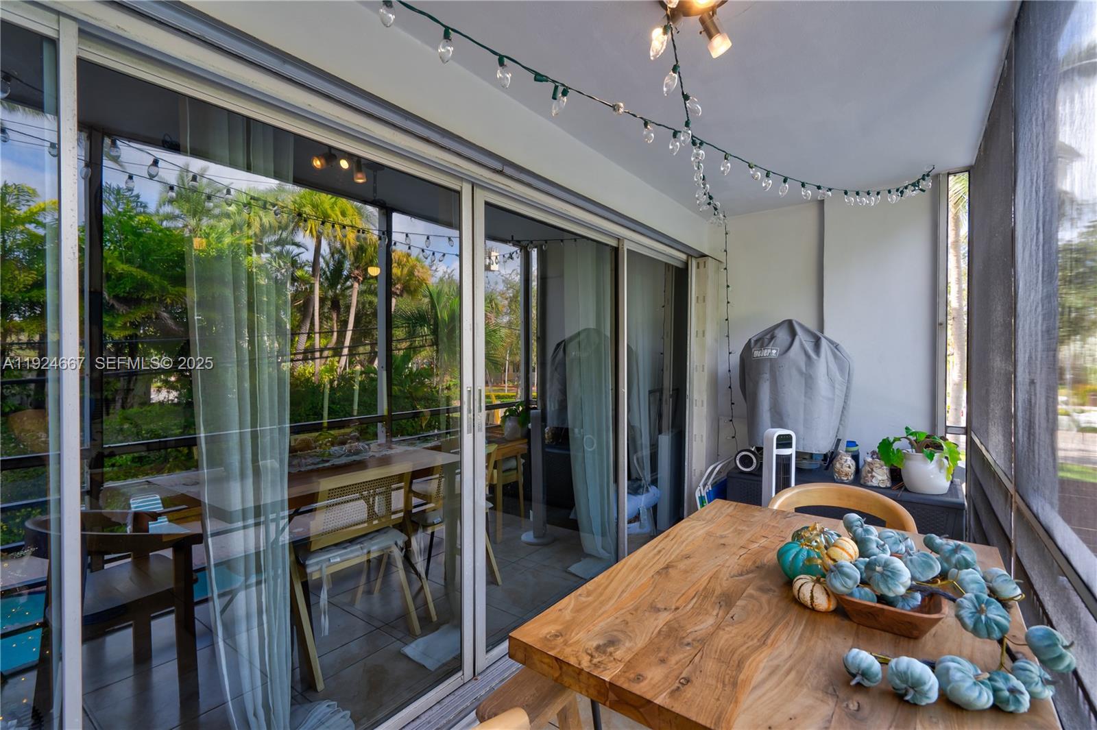 555 Crandon Boulevard, Unit 21 Key Biscayne, FL 33149 - Photo 7 of 32 a living room filled with furniture and a potted plant