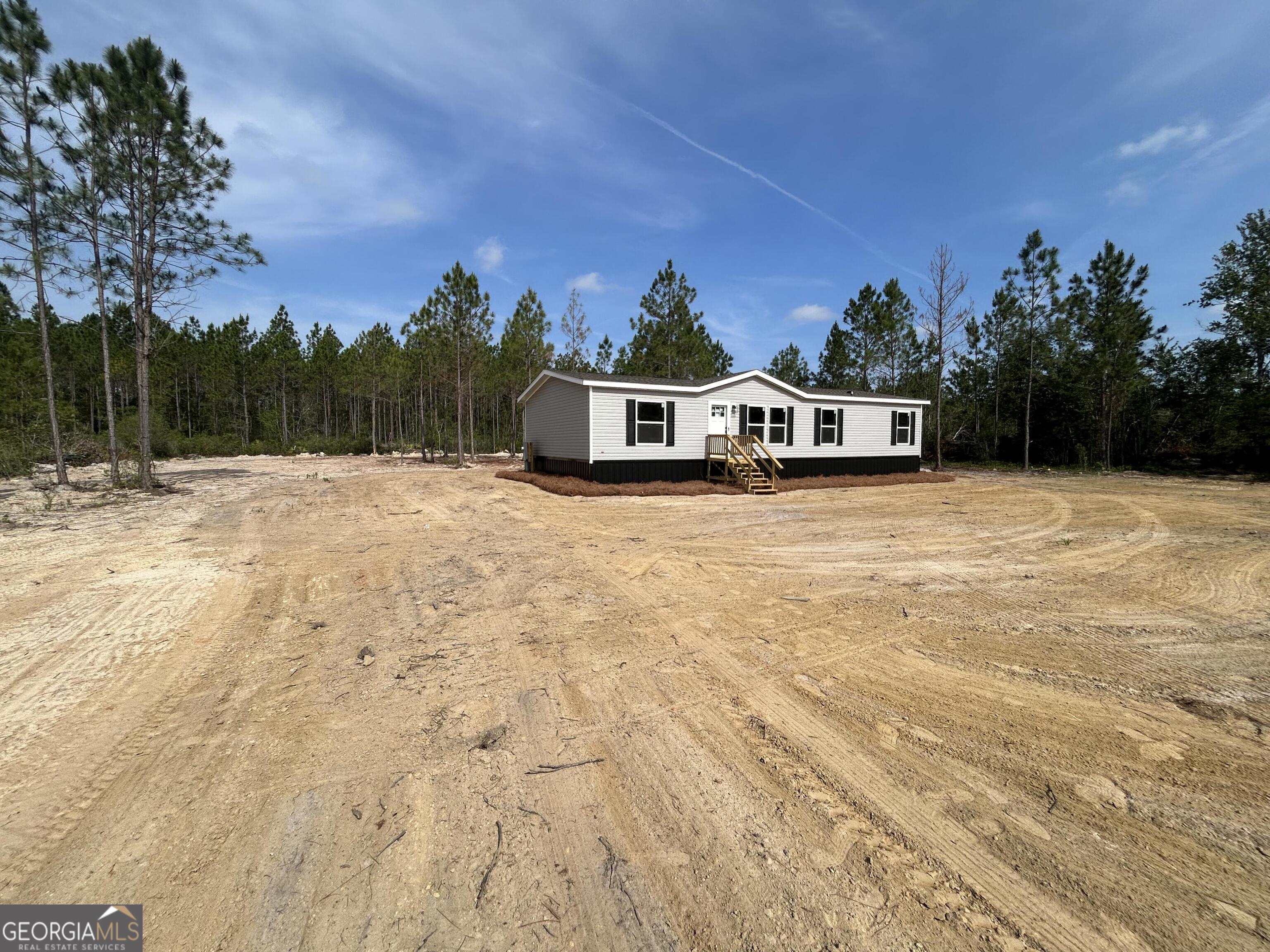 640 Elmer Thrift Road Waycross, GA 31503 - Photo 3 of 23 a view of a houses with a yard