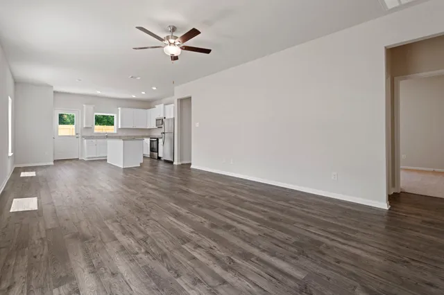 a view of kitchen and dining room with wooden floor