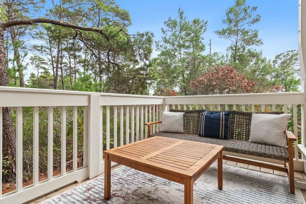 58 East Milestone Dr Inlet Beach, Unit B Inlet Beach, FL 32461 - Photo 14 of 47 a view of a balcony with furniture