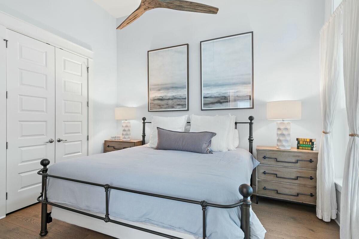 58 East Milestone Dr Inlet Beach, Unit B Inlet Beach, FL 32461 - Photo 18 of 47 a bedroom with a bed and large window