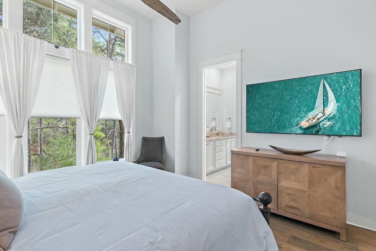 58 East Milestone Dr Inlet Beach, Unit B Inlet Beach, FL 32461 - Photo 19 of 47 a bedroom with a bed and a dresser next to a window