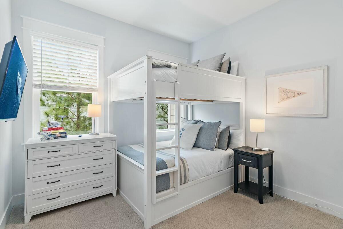 58 East Milestone Dr Inlet Beach, Unit B Inlet Beach, FL 32461 - Photo 22 of 47 a bedroom with a bed and a window