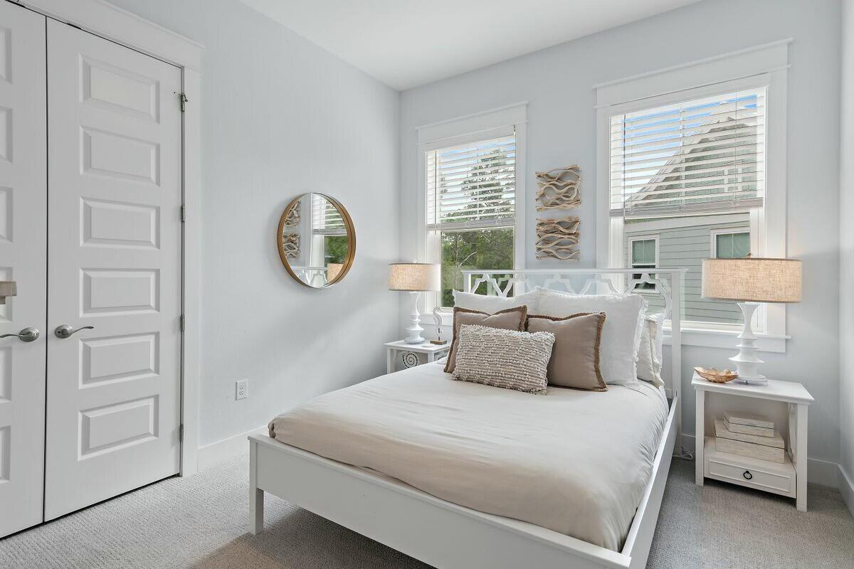 58 East Milestone Dr Inlet Beach, Unit B Inlet Beach, FL 32461 - Photo 25 of 47 a bedroom with a bed and a window