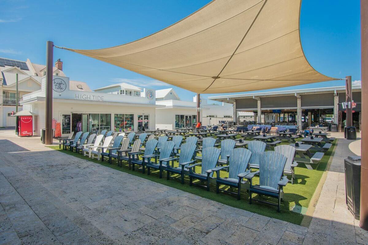 58 East Milestone Dr Inlet Beach, Unit B Inlet Beach, FL 32461 - Photo 32 of 47 a front view of a building with lots of green space