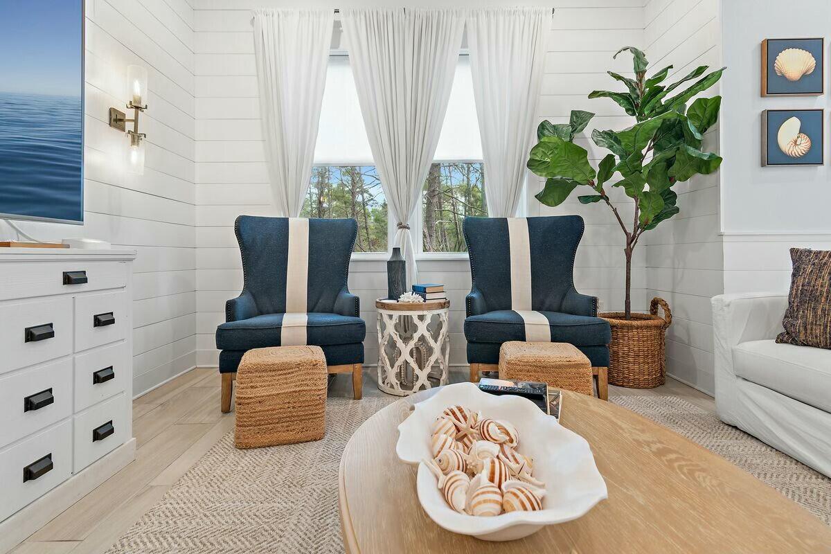 58 East Milestone Dr Inlet Beach, Unit B Inlet Beach, FL 32461 - Photo 7 of 47 a living room with furniture potted plant and a large window