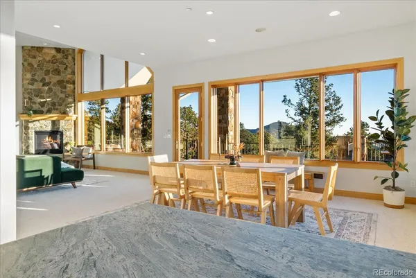 a view of a room with furniture and wooden floor