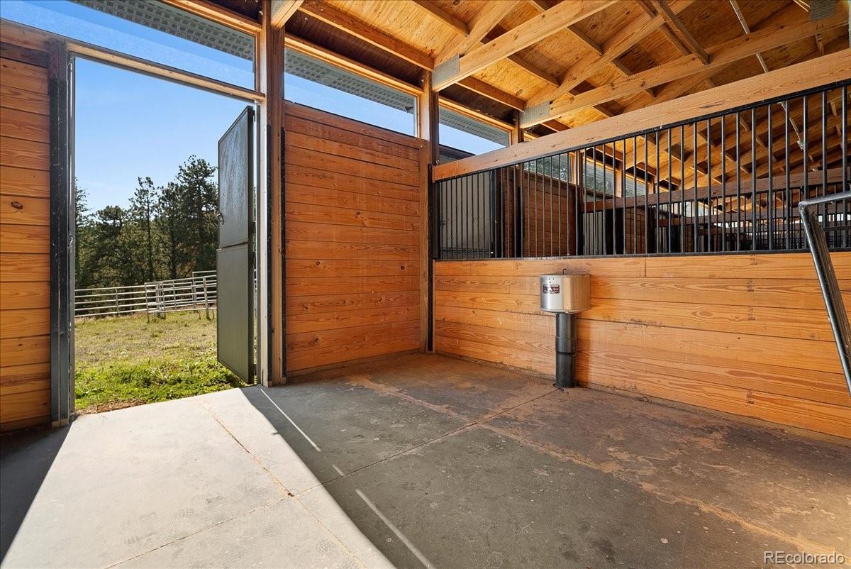20682 Falcon Wing Road Indian Hills, CO 80454 - Photo 7 of 45 a view of a pathway with a door