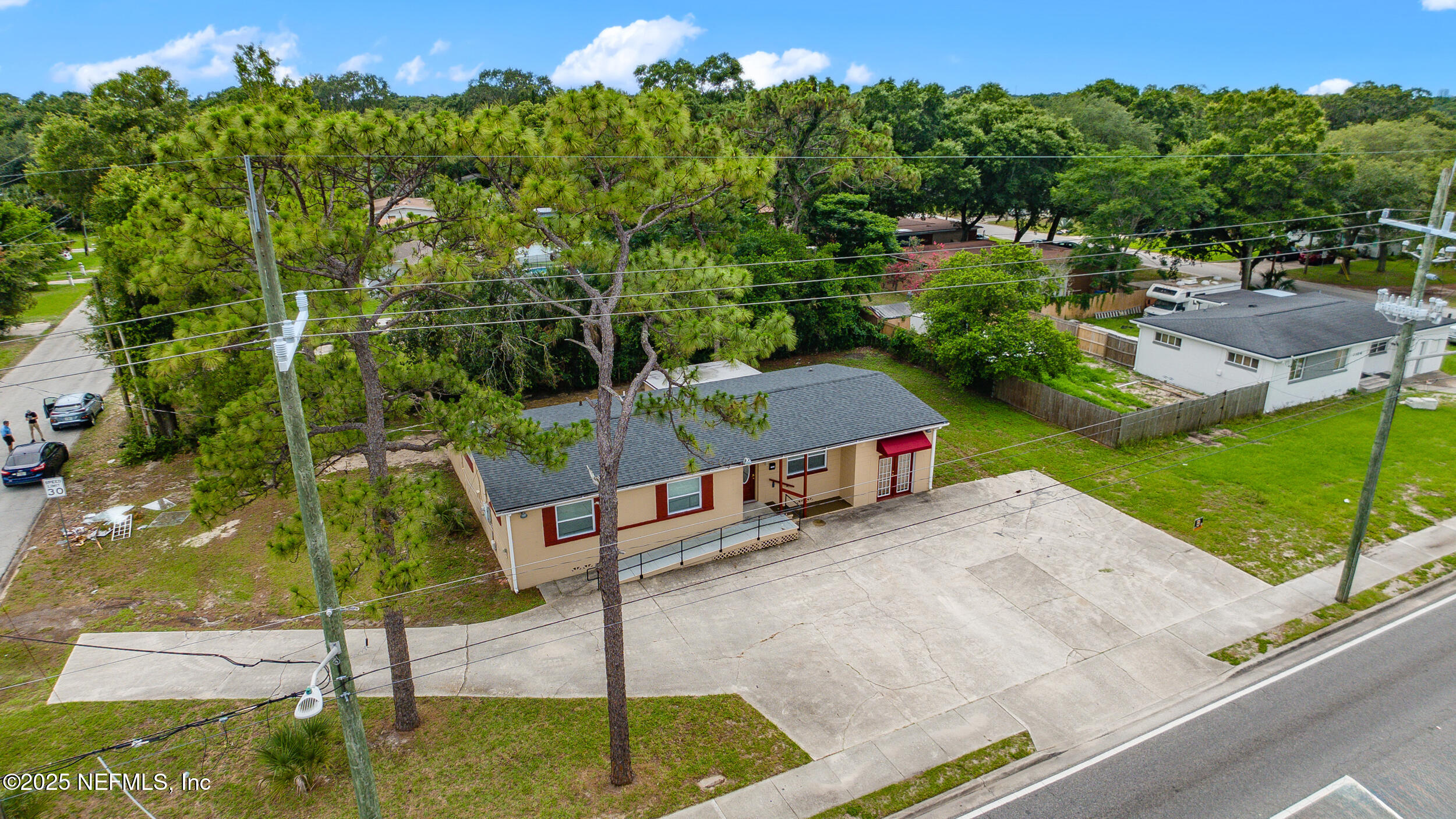 7120 Merrill Road Jacksonville, FL 32211 - Photo 2 of 60 a backyard of a house with table and chairs