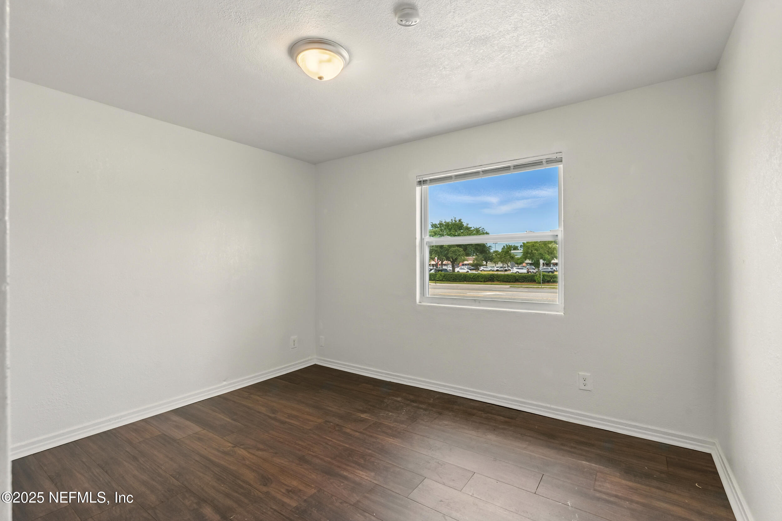 7120 Merrill Road Jacksonville, FL 32211 - Photo 23 of 60 an empty room with a window