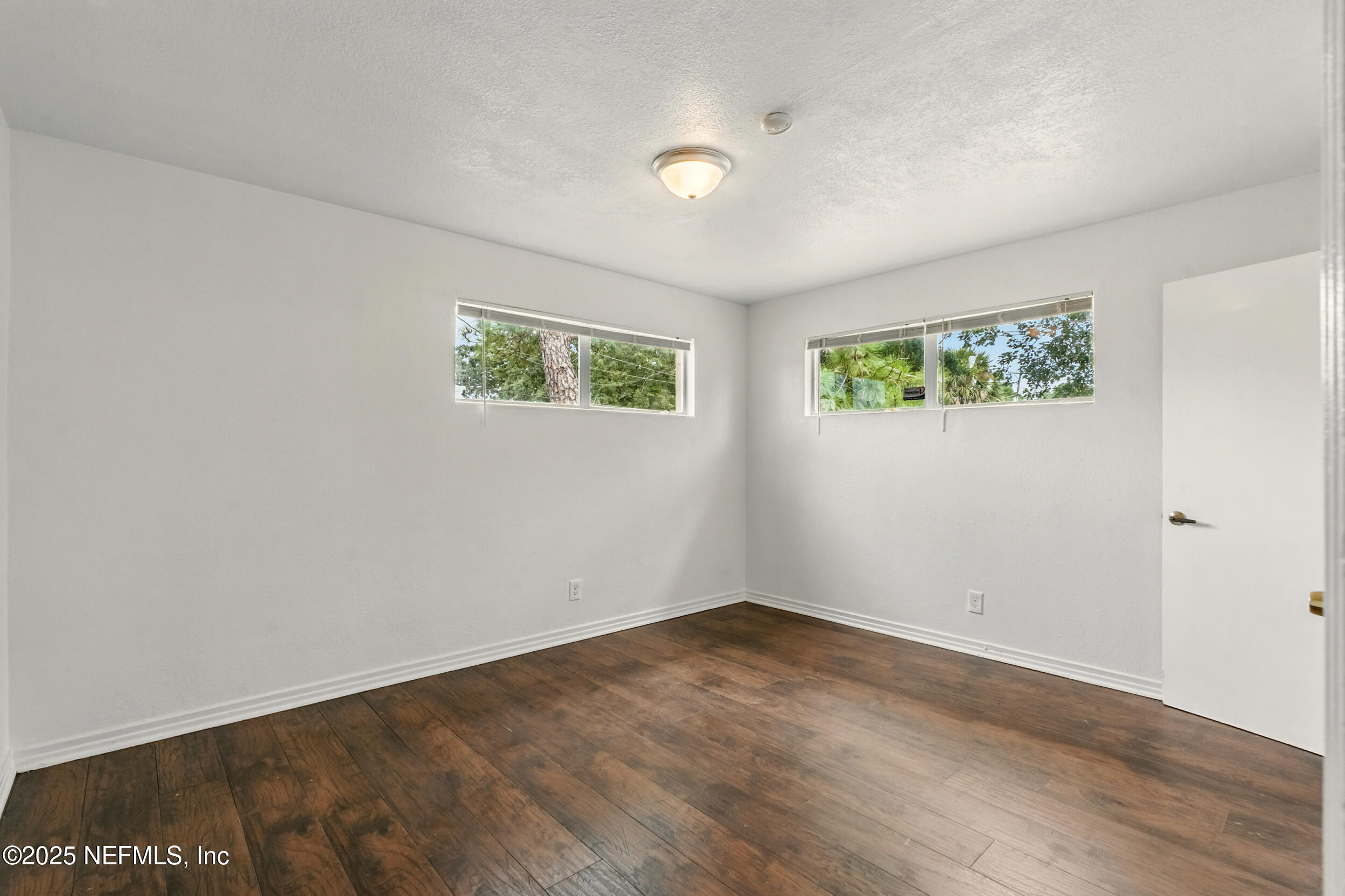 7120 Merrill Road Jacksonville, FL 32211 - Photo 27 of 60 a view of empty room with wooden floor