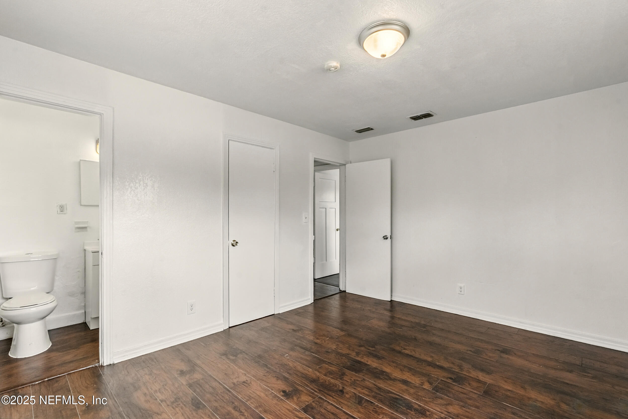 7120 Merrill Road Jacksonville, FL 32211 - Photo 28 of 60 a view of a bathroom with a toilet and a shower