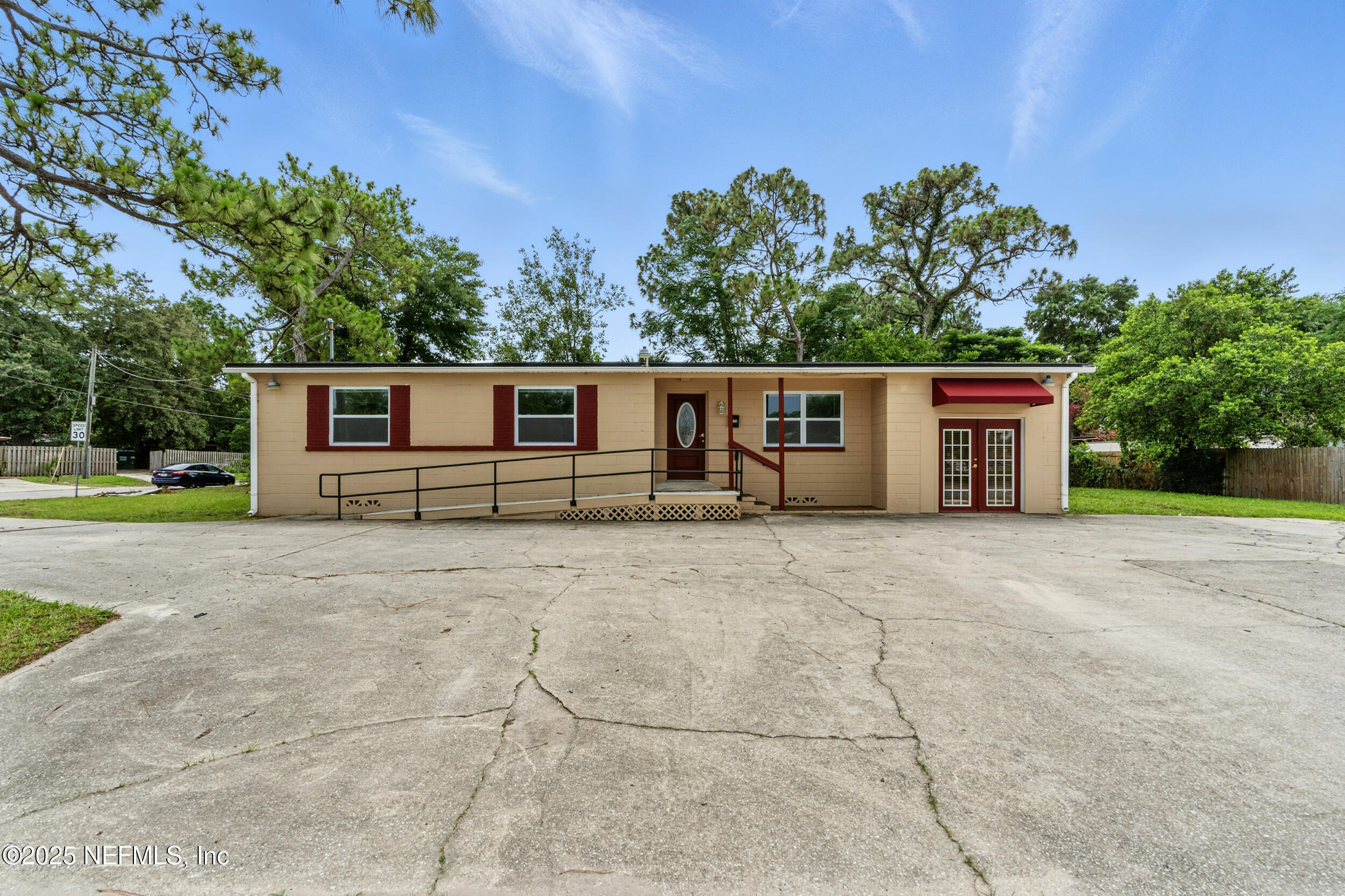 7120 Merrill Road Jacksonville, FL 32211 - Photo 3 of 60 a view of a house with backyard and a tree