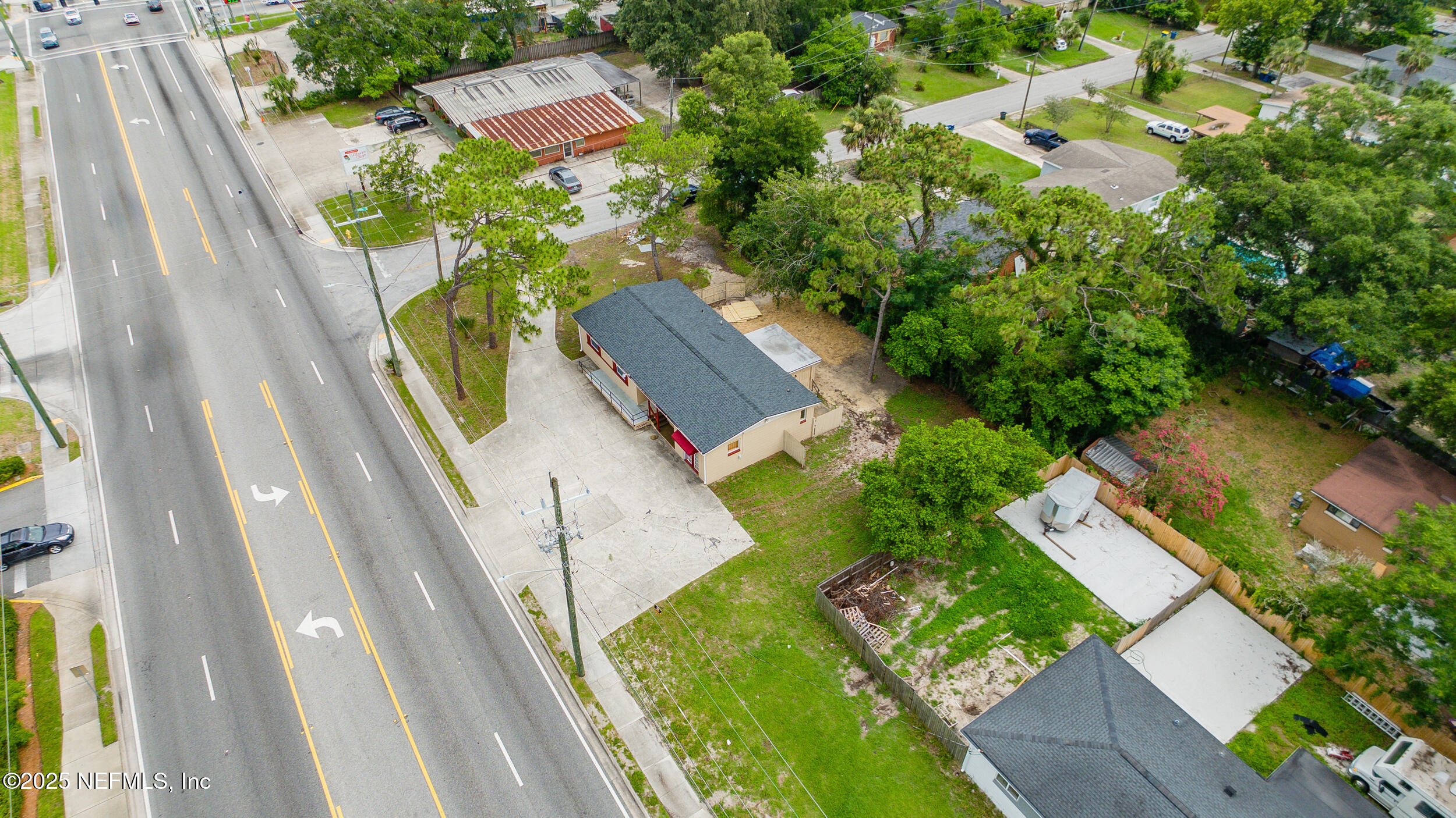 7120 Merrill Road Jacksonville, FL 32211 - Photo 58 of 60 an aerial view of a house with swimming pool and outdoor space