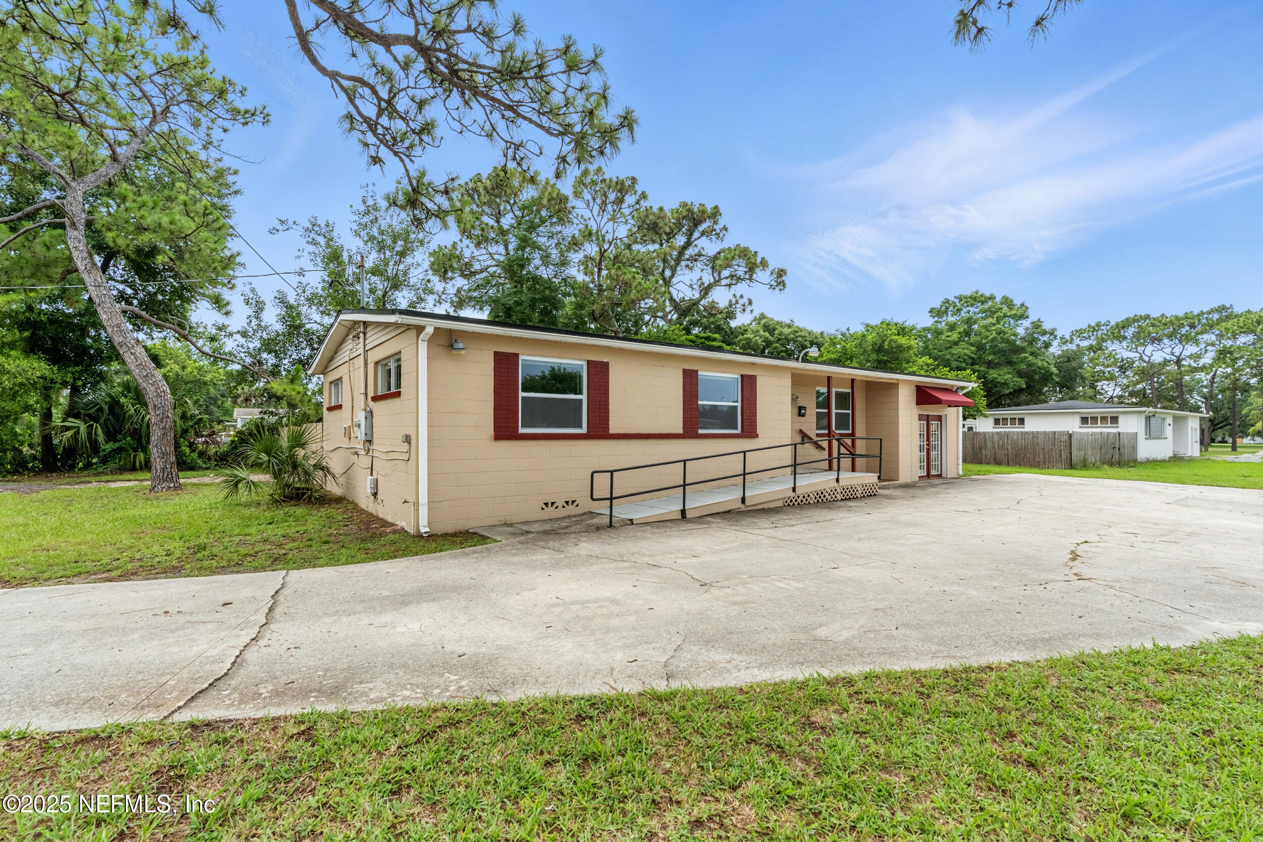 7120 Merrill Road Jacksonville, FL 32211 - Photo 5 of 60 a backyard of a house with plants and trees