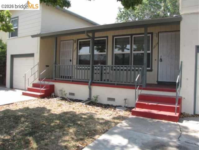 3954 Railroad Avenue, Unit 2 Pittsburg, CA 94565 - Photo 2 of 2 a view of a house with a wooden fence