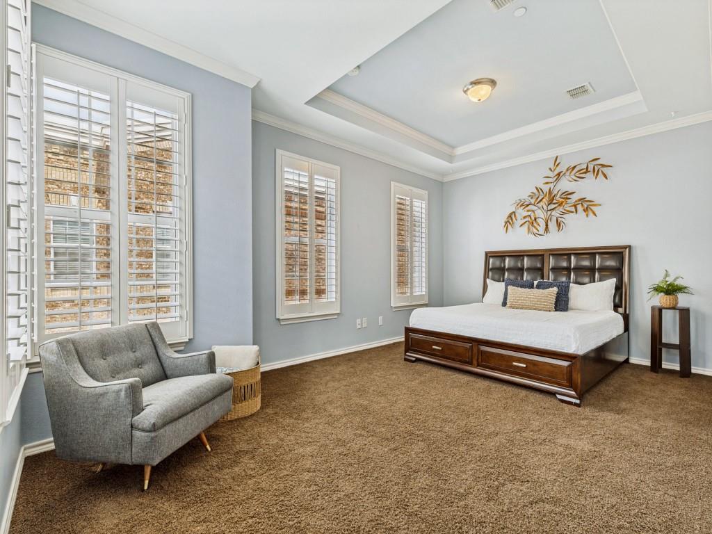 15741 Seabolt Place, Unit 28 Addison, TX 75001 - Photo 13 of 37 Bedroom with ornamental molding, dark colored carpet, and a raised ceiling