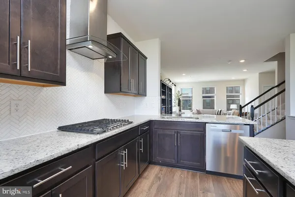 a kitchen with sink cabinets and stove