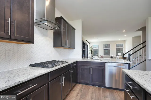 a kitchen with sink cabinets and stove
