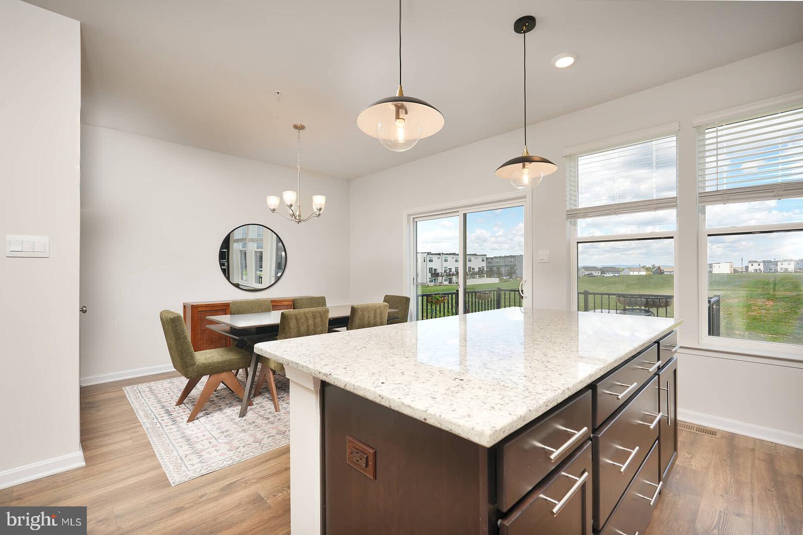 869 Amity Street Frederick, MD 21701 - Photo 17 of 48 a view of a dining room with furniture window and wooden floor