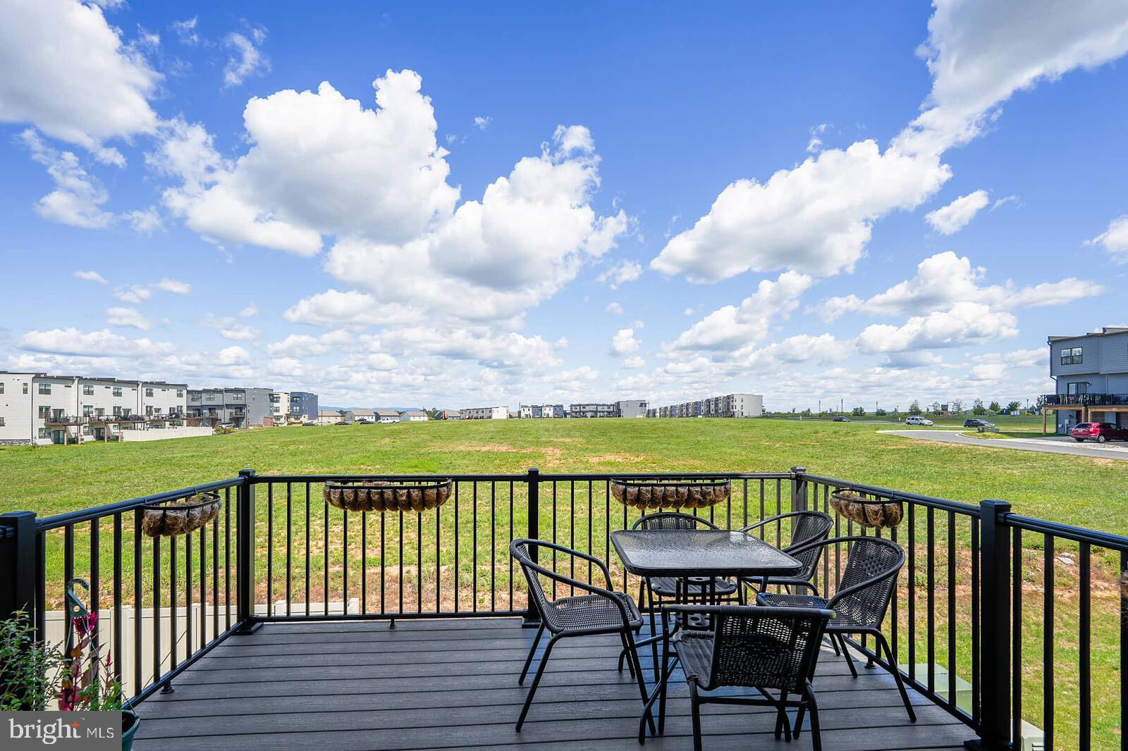 869 Amity Street Frederick, MD 21701 - Photo 20 of 48 a view of a balcony with lake view and wooden floor