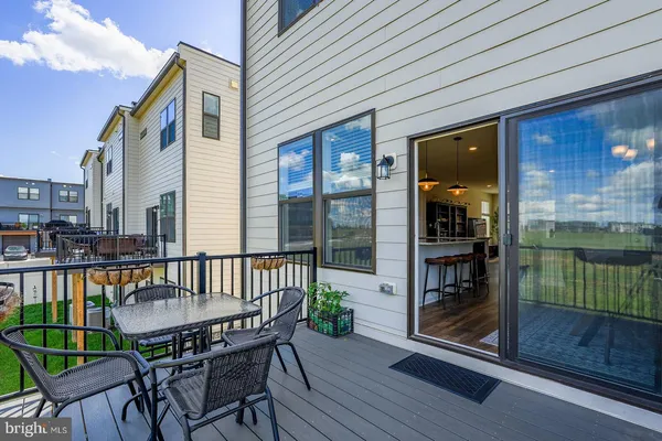 a view of a chair and table in the balcony