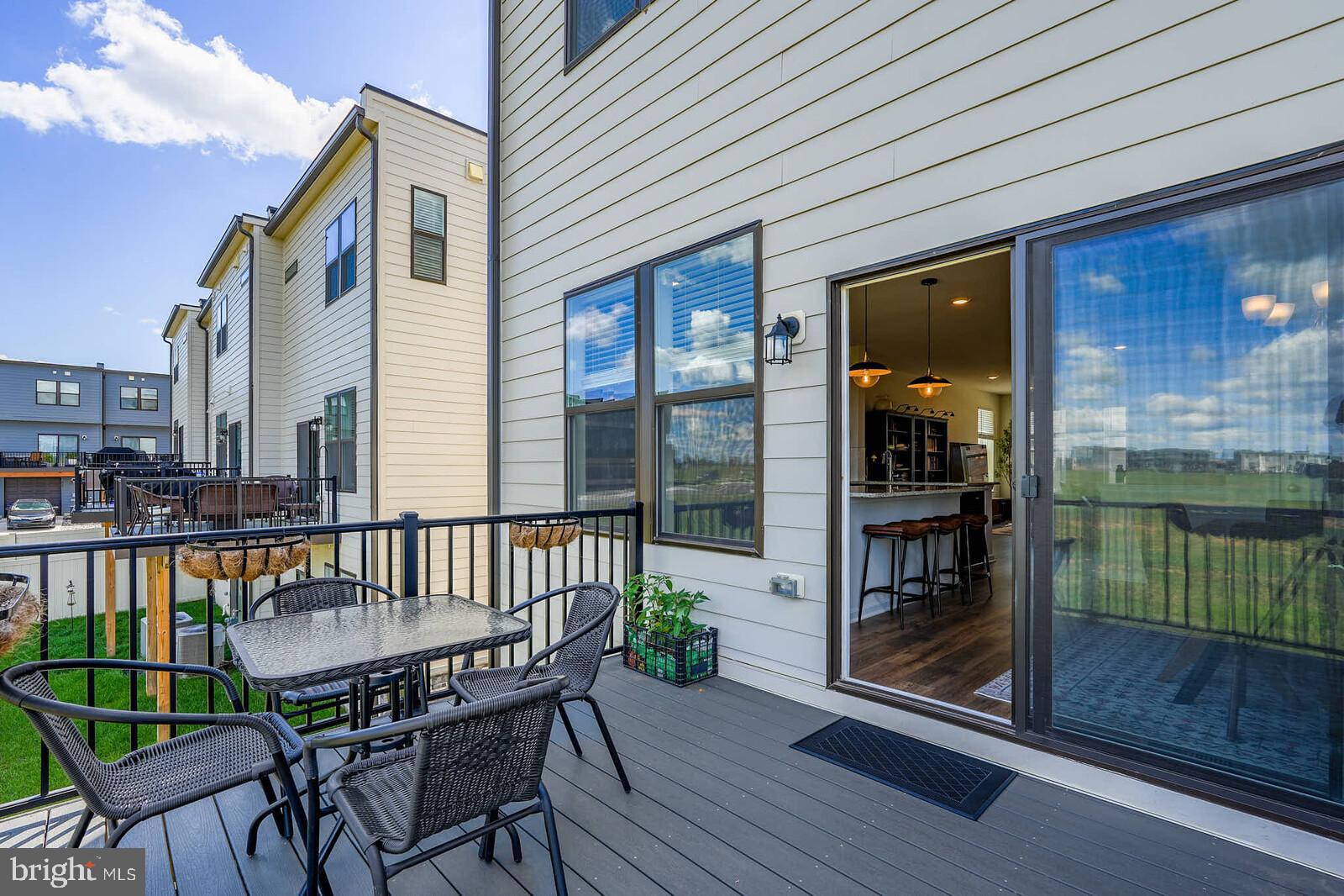 869 Amity Street Frederick, MD 21701 - Photo 22 of 48 a view of a chair and table in the balcony