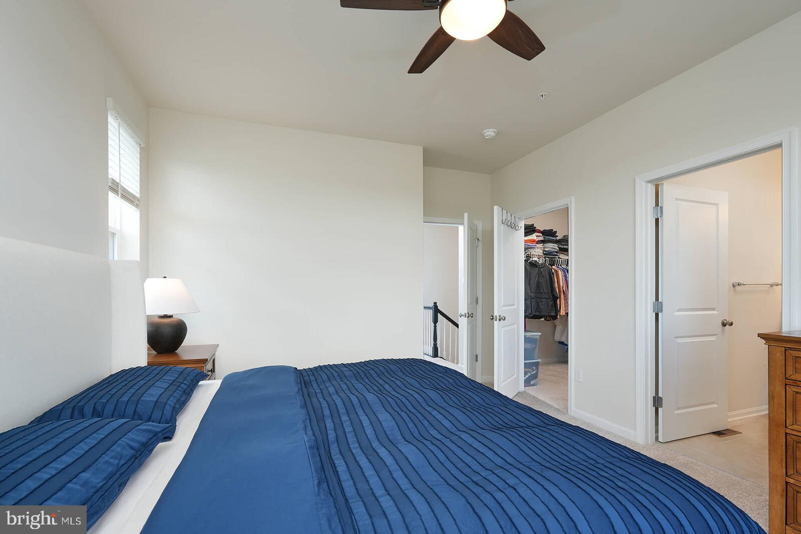 869 Amity Street Frederick, MD 21701 - Photo 32 of 48 a bedroom with a bed and wooden floor