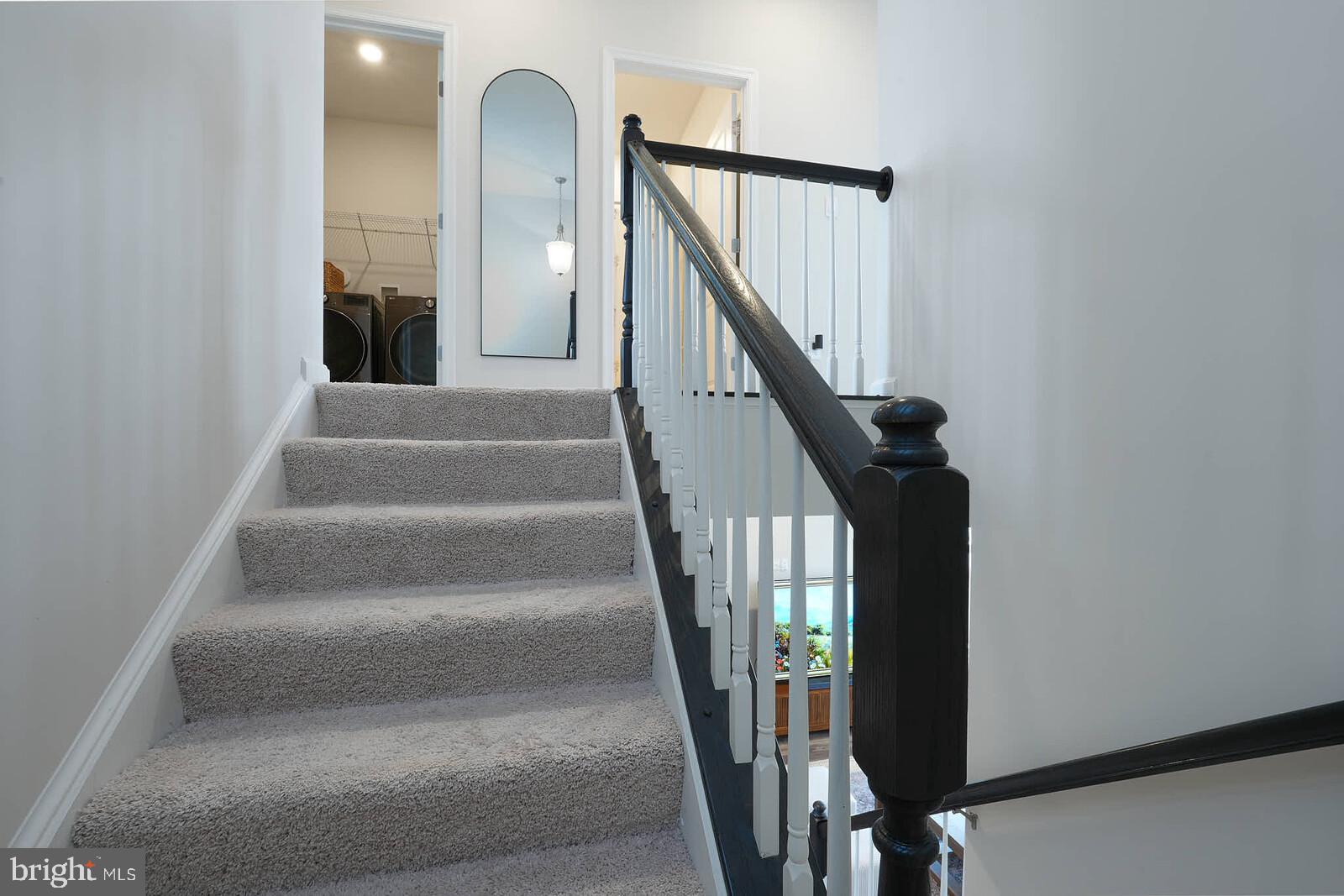 869 Amity Street Frederick, MD 21701 - Photo 37 of 48 a view of staircase with white walls and a window