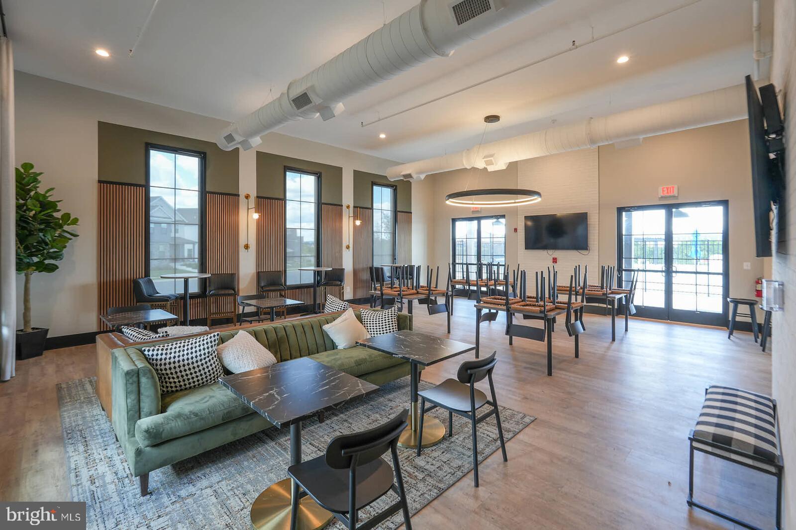 869 Amity Street Frederick, MD 21701 - Photo 45 of 48 a living room with furniture and floor to ceiling windows