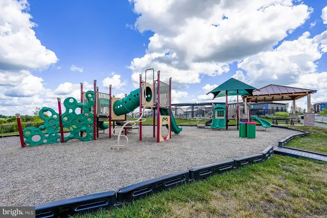 a bench is sitting in the middle of a yard