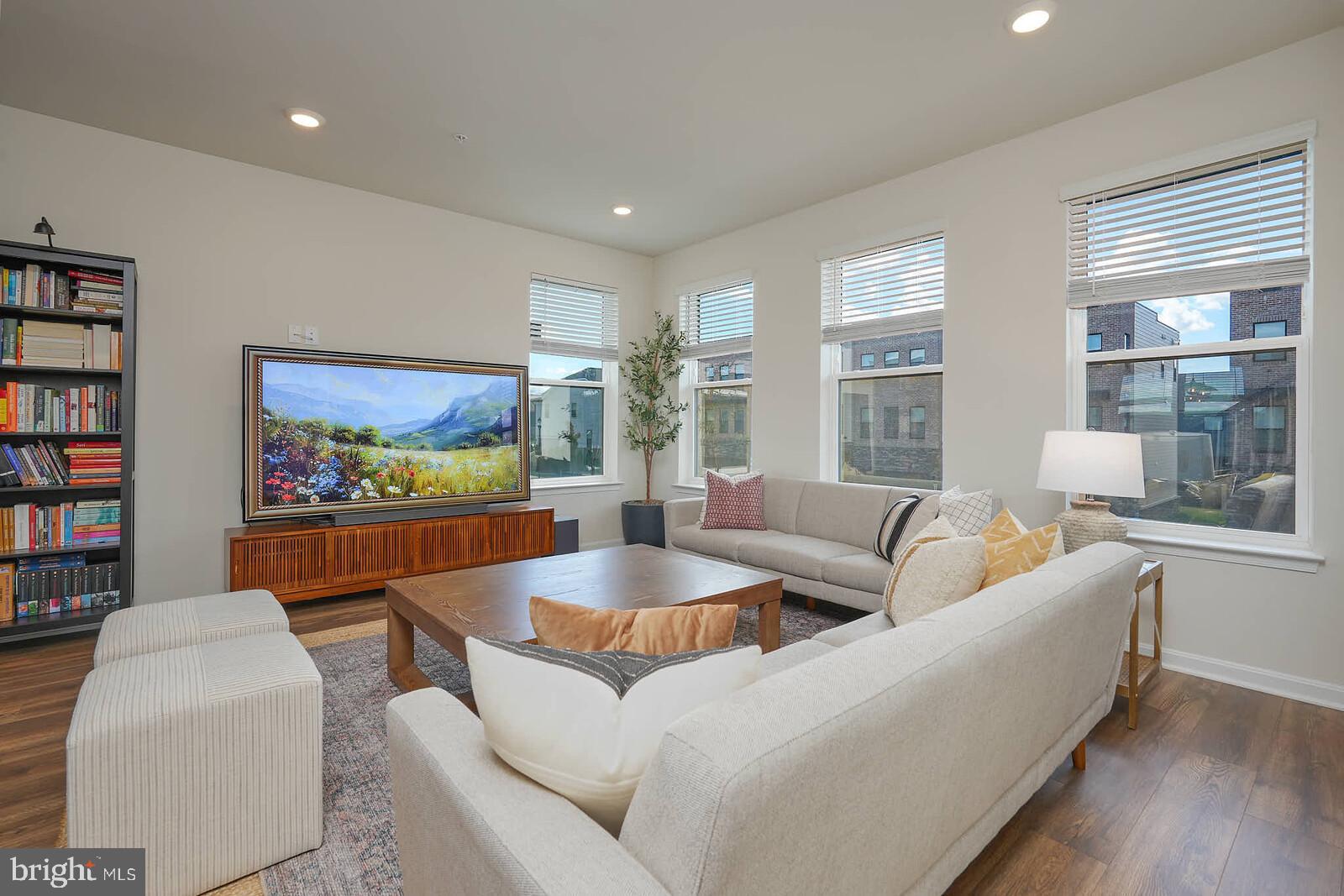 869 Amity Street Frederick, MD 21701 - Photo 9 of 48 a living room with furniture and a flat screen tv