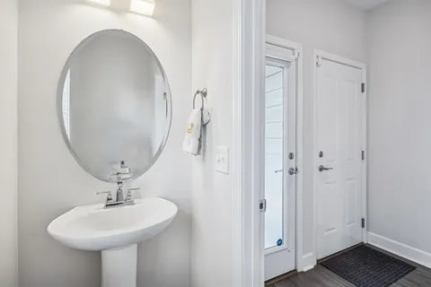 a bathroom with a sink a mirror and a toilet