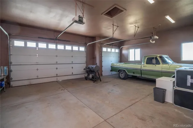a view of a garage room with furniture
