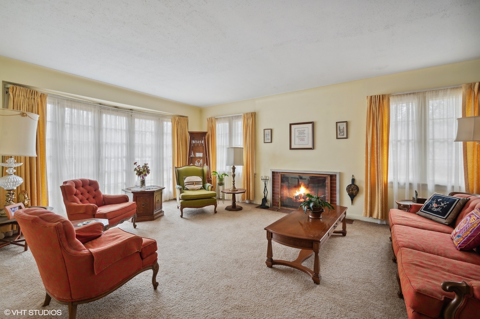 1628 South Meacham Road Rolling Meadows, IL 60008 - Photo 6 of 27 a living room with furniture and a fireplace