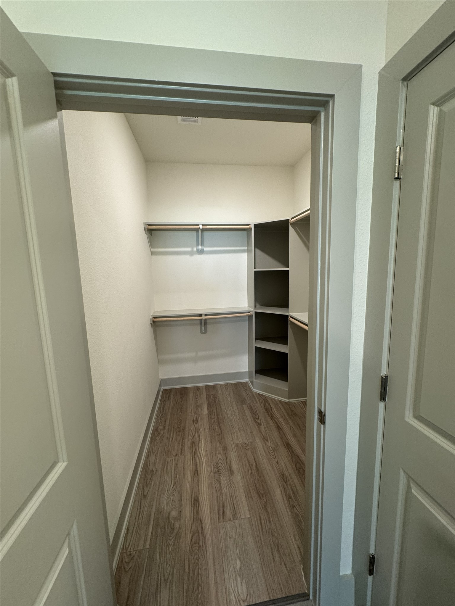 26244 Twin Oaks Road Splendora, TX 77372 - Photo 9 of 10 a view of walk in closet with empty racks
